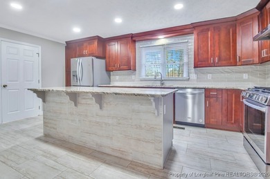 Welcome to 6208 Falkland, a beautifully appointed residence on Kings Grant Golf and Country Club in North Carolina - for sale on GolfHomes.com, golf home, golf lot