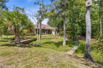 Sanctuary of Elegance and Serenity - Nestled amidst nature's on Laurel Island Links in Georgia - for sale on GolfHomes.com, golf home, golf lot