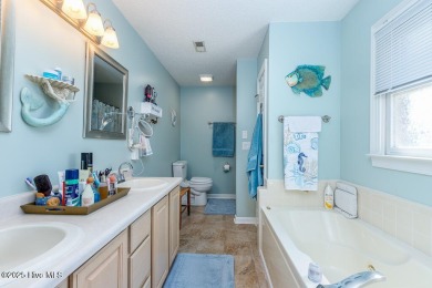 SCHEDULE YOUR SHOWING!!! COZY AND SERENE WITH THE ABILITY FOR on Harbour Point Golf Club in North Carolina - for sale on GolfHomes.com, golf home, golf lot