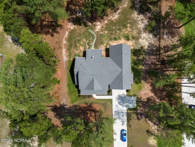 Discover the perfect home at 202 Woodland Circle in Foxfire, NC! on Foxfire Golf and Country Club in North Carolina - for sale on GolfHomes.com, golf home, golf lot