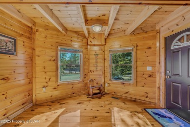 Stunning custom-built log chalet in desirable Eagle Rock Resort on Eagle Rock Golf and Ski Resort in Pennsylvania - for sale on GolfHomes.com, golf home, golf lot