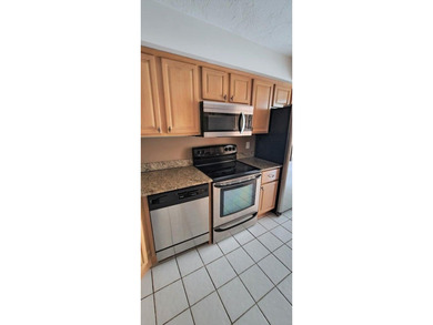 2/2 UNIT, OPEN KITCHEN, PANTRY & BREAKFAST AREA, TILED DINING on The President Country Club in Florida - for sale on GolfHomes.com, golf home, golf lot