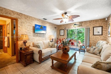 Welcome to Redbridge! This beautifully maintained single-story on Springtree Country Club in Florida - for sale on GolfHomes.com, golf home, golf lot