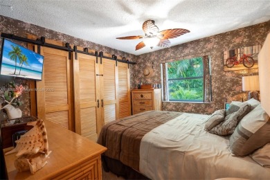 Welcome to Redbridge! This beautifully maintained single-story on Springtree Country Club in Florida - for sale on GolfHomes.com, golf home, golf lot