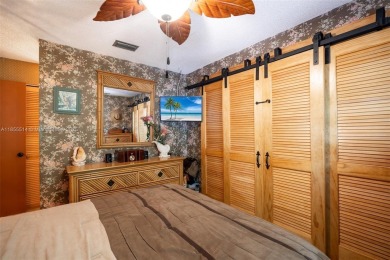 Welcome to Redbridge! This beautifully maintained single-story on Springtree Country Club in Florida - for sale on GolfHomes.com, golf home, golf lot