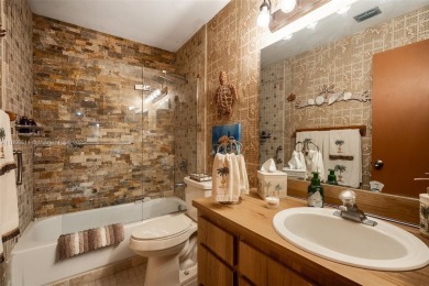 Welcome to Redbridge! This beautifully maintained single-story on Springtree Country Club in Florida - for sale on GolfHomes.com, golf home, golf lot