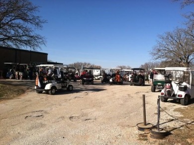 Nice level cleared off half acre lot with mature oak trees on Nocona Hills Golf Course in Texas - for sale on GolfHomes.com, golf home, golf lot