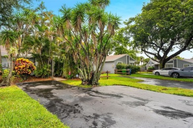 Welcome to Redbridge! This beautifully maintained single-story on Springtree Country Club in Florida - for sale on GolfHomes.com, golf home, golf lot