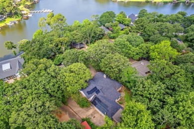 Experience resort-style living in this beautiful 4-bedroom on Hide-A-Way Lake Golf Course in Texas - for sale on GolfHomes.com, golf home, golf lot