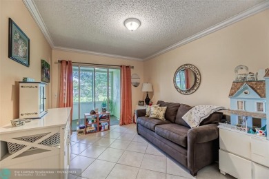 This charming, partially furnished, two bedroom, one and a half on Hillsboro Pines Golf in Florida - for sale on GolfHomes.com, golf home, golf lot