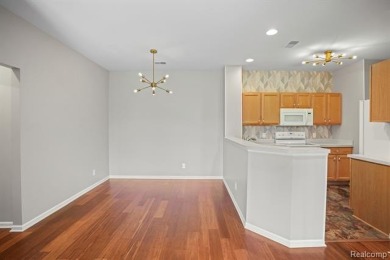Welcome to this beautifully updated upper-level 2-bedroom on The Captains Club At Woodfield in Michigan - for sale on GolfHomes.com, golf home, golf lot
