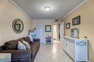This charming, partially furnished, two bedroom, one and a half on Hillsboro Pines Golf in Florida - for sale on GolfHomes.com, golf home, golf lot