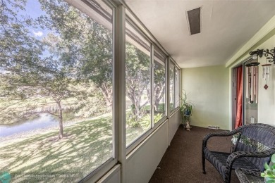 This charming, partially furnished, two bedroom, one and a half on Hillsboro Pines Golf in Florida - for sale on GolfHomes.com, golf home, golf lot