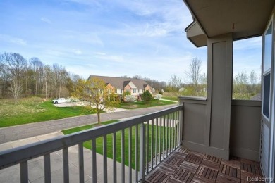 Welcome to this beautifully updated upper-level 2-bedroom on The Captains Club At Woodfield in Michigan - for sale on GolfHomes.com, golf home, golf lot