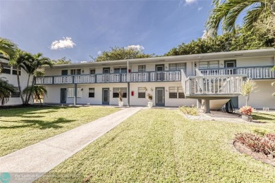 This charming, partially furnished, two bedroom, one and a half on Hillsboro Pines Golf in Florida - for sale on GolfHomes.com, golf home, golf lot