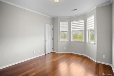 Welcome to this beautifully updated upper-level 2-bedroom on The Captains Club At Woodfield in Michigan - for sale on GolfHomes.com, golf home, golf lot