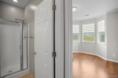 Welcome to this beautifully updated upper-level 2-bedroom on The Captains Club At Woodfield in Michigan - for sale on GolfHomes.com, golf home, golf lot