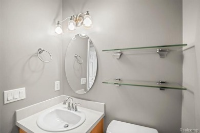 Welcome to this beautifully updated upper-level 2-bedroom on The Captains Club At Woodfield in Michigan - for sale on GolfHomes.com, golf home, golf lot