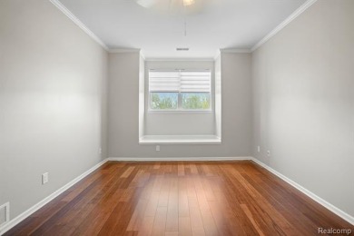 Welcome to this beautifully updated upper-level 2-bedroom on The Captains Club At Woodfield in Michigan - for sale on GolfHomes.com, golf home, golf lot