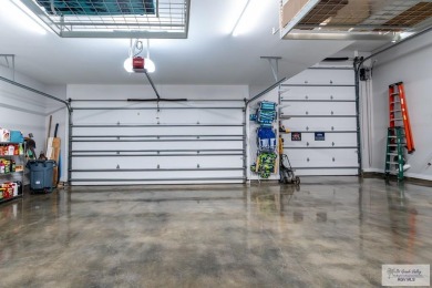 Spacious garage is 1242 sq ft which includes two car garage (24 on South Padre Island Golf Club in Texas - for sale on GolfHomes.com, golf home, golf lot