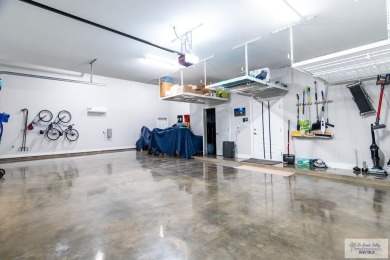 Spacious garage is 1242 sq ft which includes two car garage (24 on South Padre Island Golf Club in Texas - for sale on GolfHomes.com, golf home, golf lot