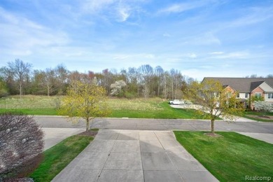 Welcome to this beautifully updated upper-level 2-bedroom on The Captains Club At Woodfield in Michigan - for sale on GolfHomes.com, golf home, golf lot