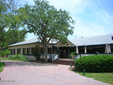 Exquisite 3-Bedroom, 2-Bath Pool Home in prestigious 24/7 staff on Spruce Creek Golf Club in Florida - for sale on GolfHomes.com, golf home, golf lot