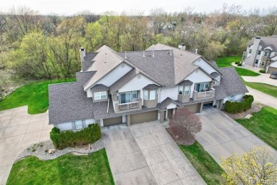 Welcome to this beautifully updated upper-level 2-bedroom on The Captains Club At Woodfield in Michigan - for sale on GolfHomes.com, golf home, golf lot