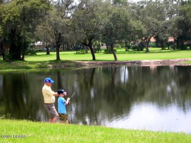 Exquisite 3-Bedroom, 2-Bath Pool Home in prestigious 24/7 staff on Spruce Creek Golf Club in Florida - for sale on GolfHomes.com, golf home, golf lot