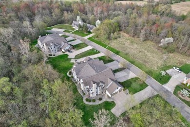 Welcome to this beautifully updated upper-level 2-bedroom on The Captains Club At Woodfield in Michigan - for sale on GolfHomes.com, golf home, golf lot