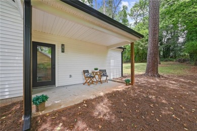 Step onto the inviting front porch and enter into a space where on East Lake Golf Club in Georgia - for sale on GolfHomes.com, golf home, golf lot