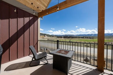 Enjoy sweeping mountain and golf course views from the covered on Grand Elk Ranch and Club in Colorado - for sale on GolfHomes.com, golf home, golf lot