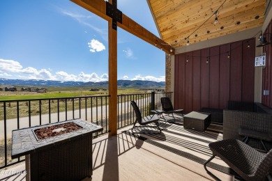 Enjoy sweeping mountain and golf course views from the covered on Grand Elk Ranch and Club in Colorado - for sale on GolfHomes.com, golf home, golf lot