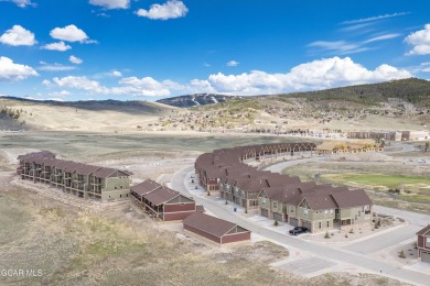 Enjoy sweeping mountain and golf course views from the covered on Grand Elk Ranch and Club in Colorado - for sale on GolfHomes.com, golf home, golf lot