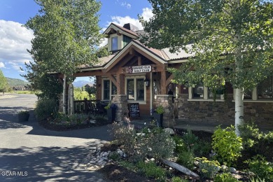 Enjoy sweeping mountain and golf course views from the covered on Grand Elk Ranch and Club in Colorado - for sale on GolfHomes.com, golf home, golf lot