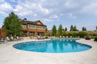 Enjoy sweeping mountain and golf course views from the covered on Grand Elk Ranch and Club in Colorado - for sale on GolfHomes.com, golf home, golf lot