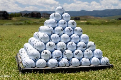 Enjoy sweeping mountain and golf course views from the covered on Grand Elk Ranch and Club in Colorado - for sale on GolfHomes.com, golf home, golf lot
