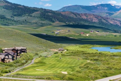 Enjoy sweeping mountain and golf course views from the covered on Grand Elk Ranch and Club in Colorado - for sale on GolfHomes.com, golf home, golf lot