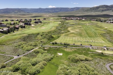 Enjoy sweeping mountain and golf course views from the covered on Grand Elk Ranch and Club in Colorado - for sale on GolfHomes.com, golf home, golf lot