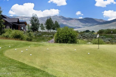 Enjoy sweeping mountain and golf course views from the covered on Grand Elk Ranch and Club in Colorado - for sale on GolfHomes.com, golf home, golf lot