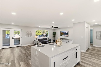 Completely remodeled home with beautiful new LVP flooring on Sunland Village Golf Club in Arizona - for sale on GolfHomes.com, golf home, golf lot