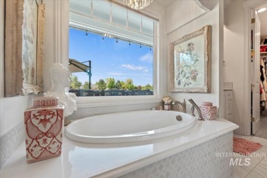 Nestled on a beautiful half-acre lot, overlooking the 11th hole on BanBury Golf Club in Idaho - for sale on GolfHomes.com, golf home, golf lot
