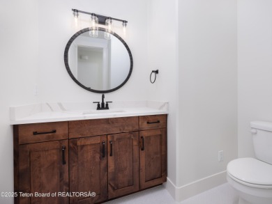 This new construction home nestled on a Teton Reserve corner lot on Teton Reserve in Idaho - for sale on GolfHomes.com, golf home, golf lot