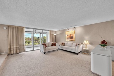 RARE CORNER KING MODEL IN PALM AIRE WITH GOLF VIEWS FROM EVERY on Palm-Aire Country Club and Resort - The Oaks in Florida - for sale on GolfHomes.com, golf home, golf lot