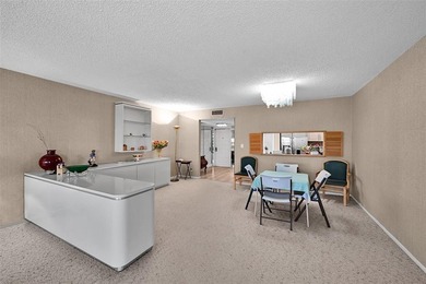 RARE CORNER KING MODEL IN PALM AIRE WITH GOLF VIEWS FROM EVERY on Palm-Aire Country Club and Resort - The Oaks in Florida - for sale on GolfHomes.com, golf home, golf lot