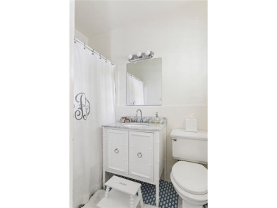 Beautifully updated and full of charm, this home is nestled in on Bobby Jones Golf Club in Georgia - for sale on GolfHomes.com, golf home, golf lot