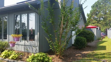 REMODEL WORK UNDERWAY ON THIS WATERFRONT BEAUTY! Please excuse on Woodlake Country Club in North Carolina - for sale on GolfHomes.com, golf home, golf lot