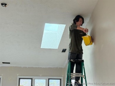 REMODEL WORK UNDERWAY ON THIS WATERFRONT BEAUTY! Please excuse on Woodlake Country Club in North Carolina - for sale on GolfHomes.com, golf home, golf lot