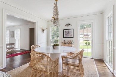 Beautifully updated and full of charm, this home is nestled in on Bobby Jones Golf Club in Georgia - for sale on GolfHomes.com, golf home, golf lot