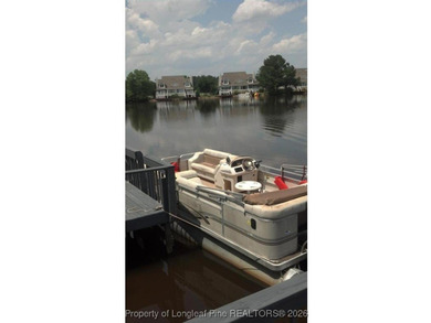 REMODEL WORK UNDERWAY ON THIS WATERFRONT BEAUTY! Please excuse on Woodlake Country Club in North Carolina - for sale on GolfHomes.com, golf home, golf lot